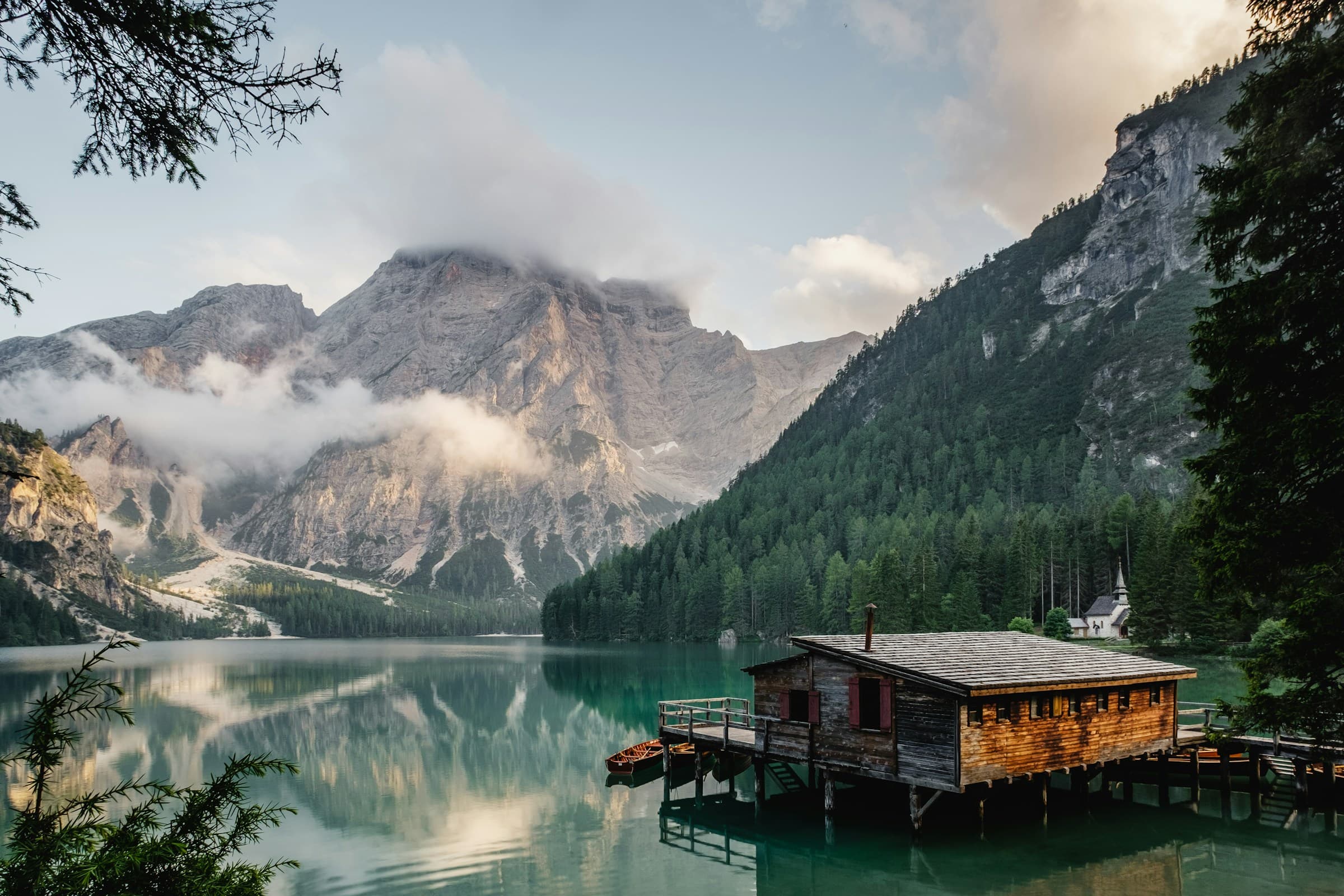 Alpine mountains reflected in a quiet lake at sunset